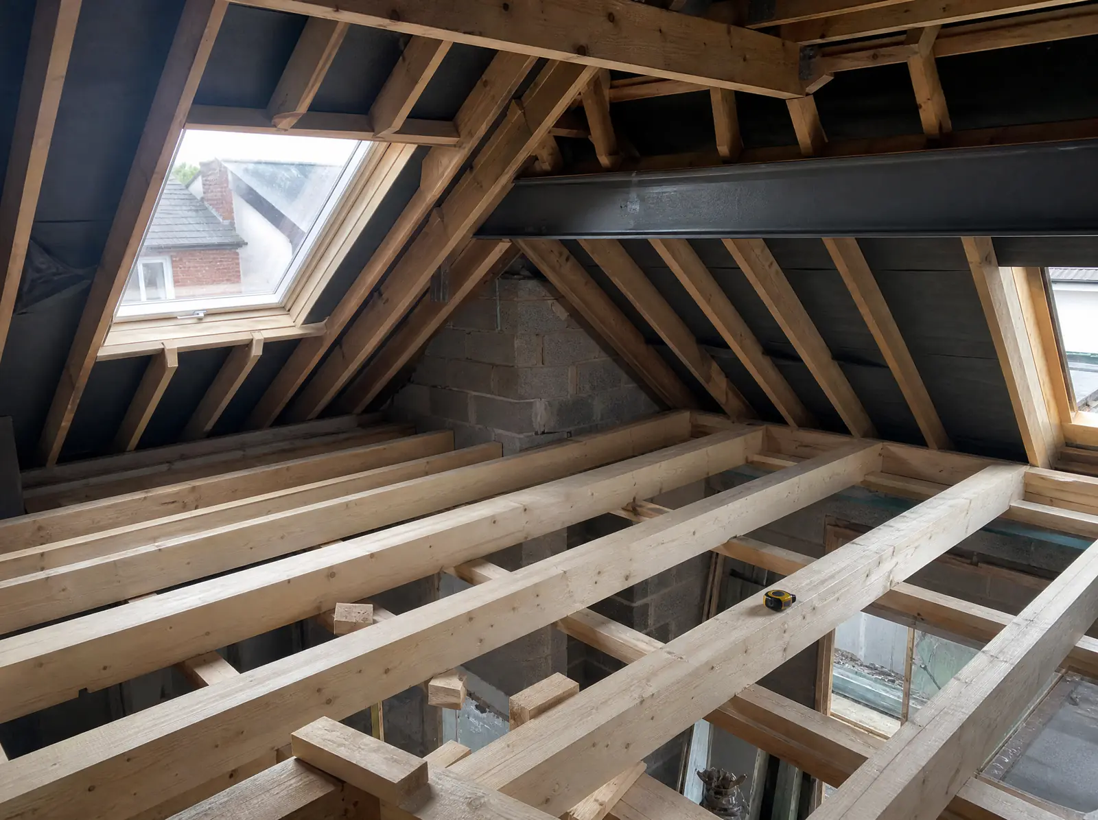 New C24 floor joists and a steel beam in an attic conversion in an Irish semi-detached house