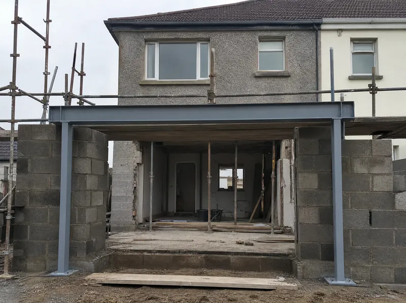 Steel goalpost frame in the opening for a rear extension on an Irish semi